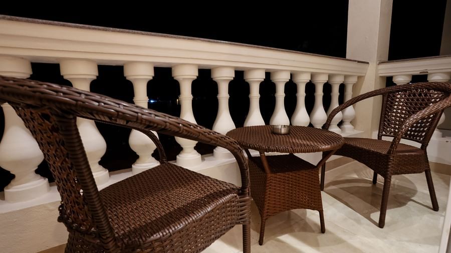 Image of a balcony with a table and two chairs beside it at Calux Grand Baga.